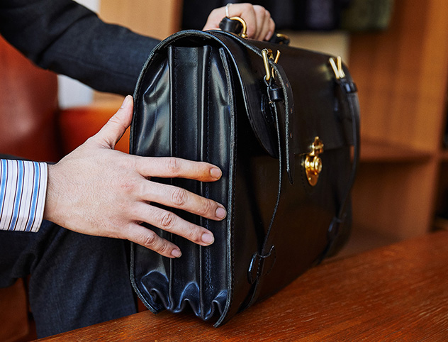 A dignified briefcase loved by the owner of a shoeshine shop that